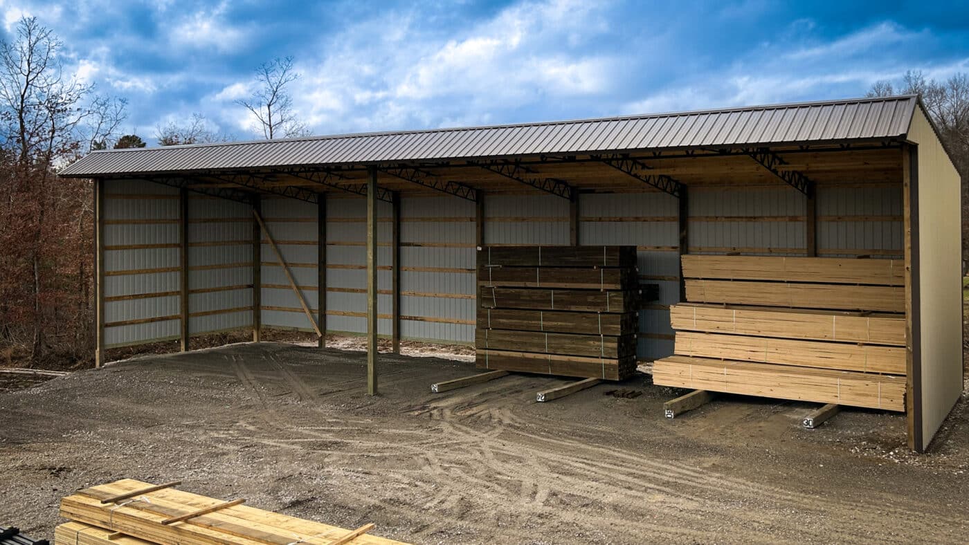 new gray pole barn equipment shed with snoot truss