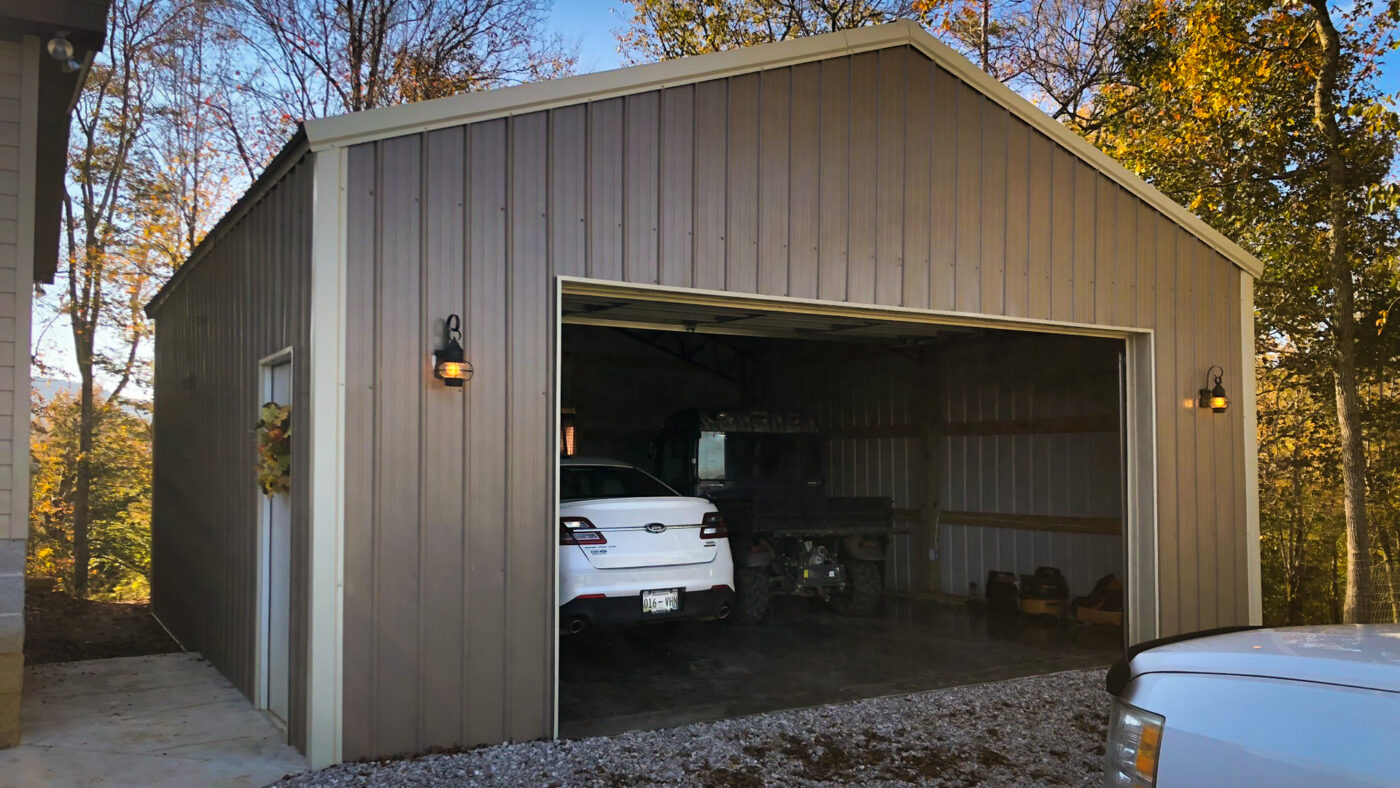 pole barn garage brown with cars