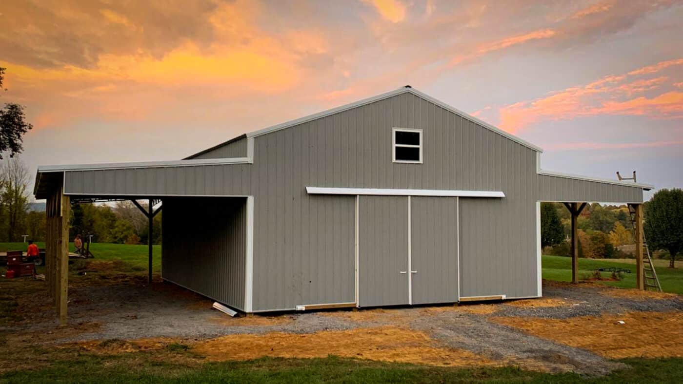 pole barn workshop gray with sunset